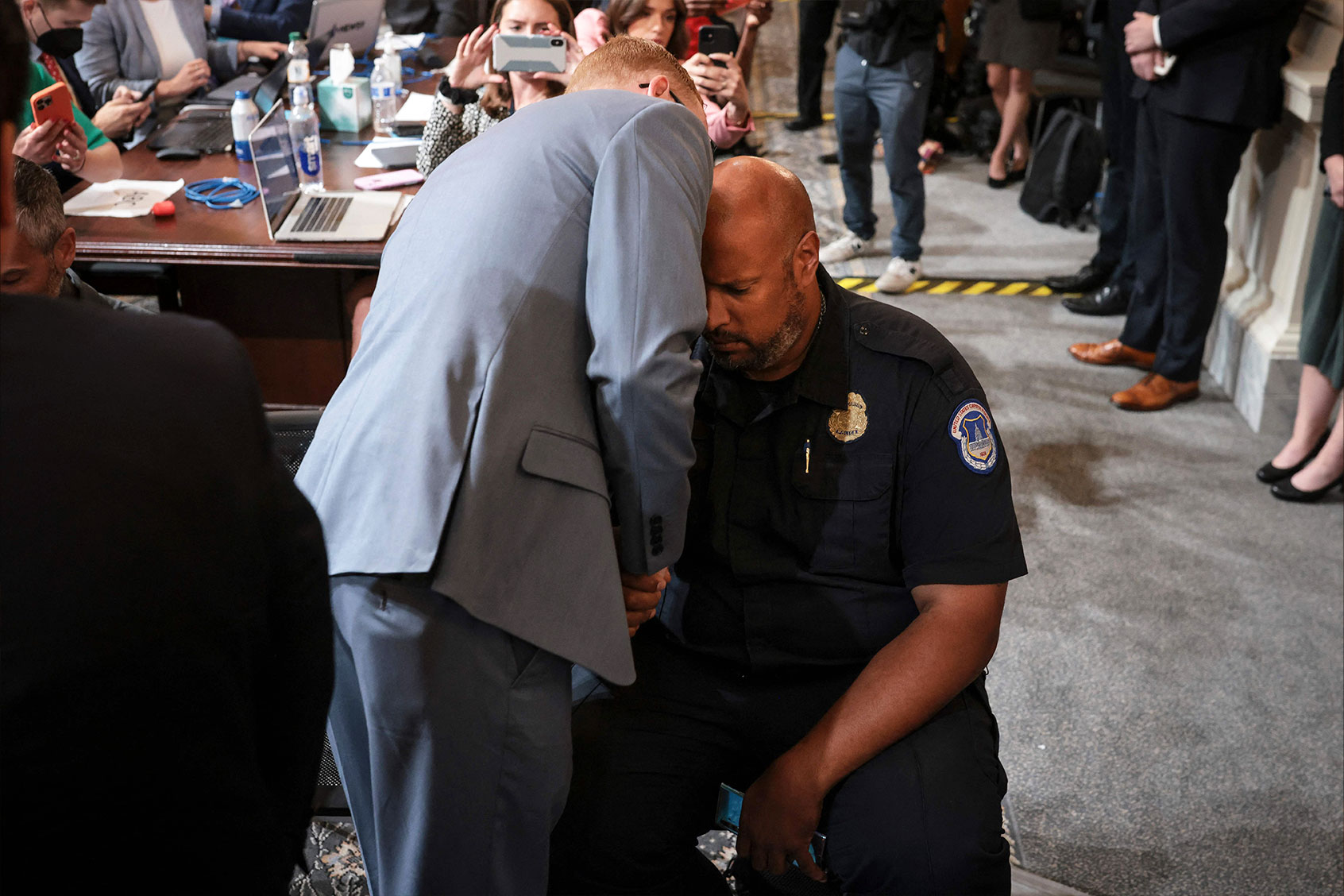 Stephen Ayres (L), who has pleaded guilty to entering the Capitol illegally on January 6, talks to US Capitol Police Officer Harry Dunn (R) at the conclusion of a full committee hearing on "the January 6th Investigation," on Capitol Hill on July 12, 2022, in Washington, DC. (OLIVER CONTRERAS/AFP via Getty Images)