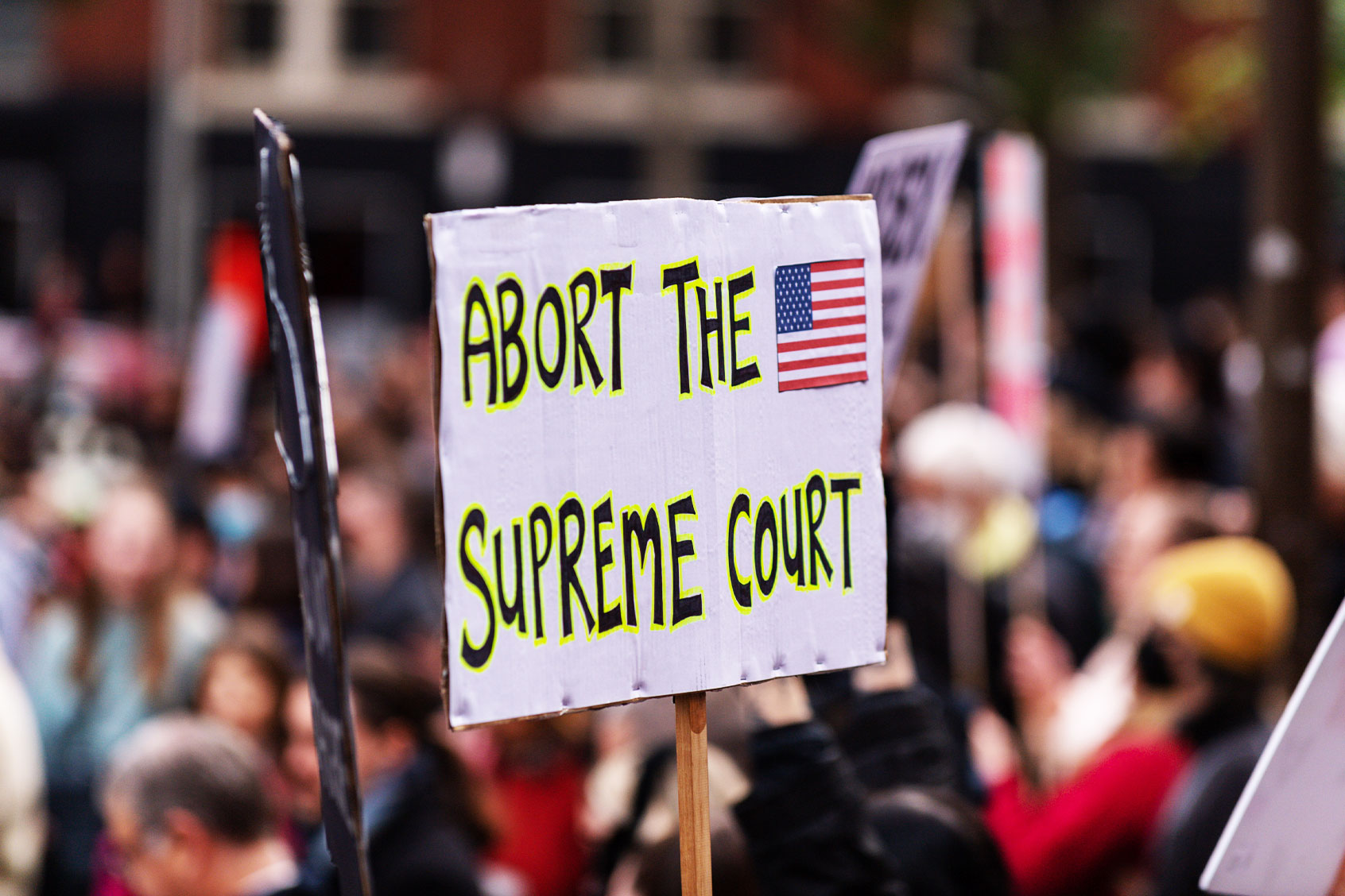 A protester holds a placard expressing her opinion during the demonstration. (Michael Currie/SOPA Images/LightRocket via Getty Images)