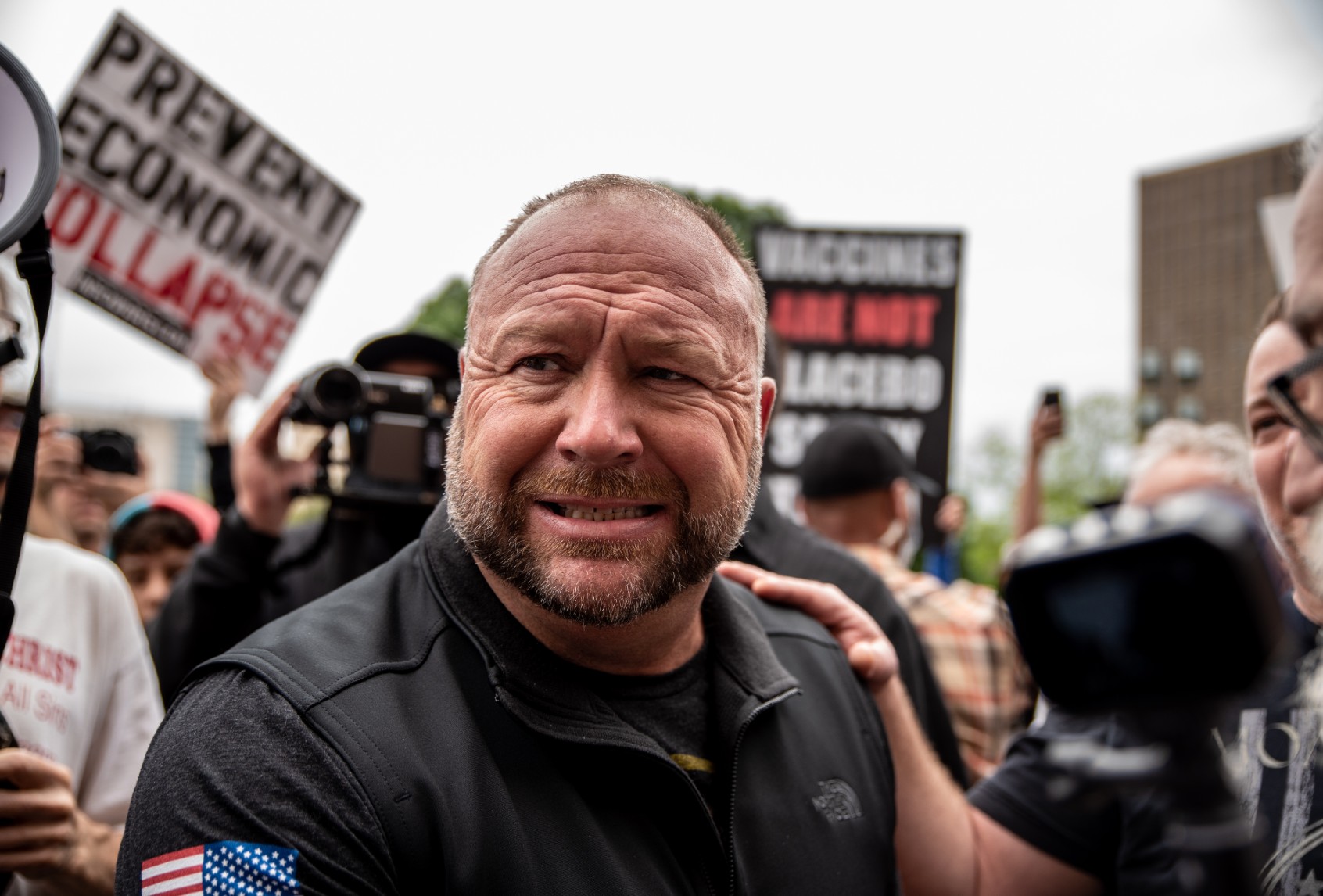 Infowars founder Alex Jones interacts with supporters at the Texas State Capital building on April 18, 2020 in Austin, Texas. (Sergio Flores/Getty Images)