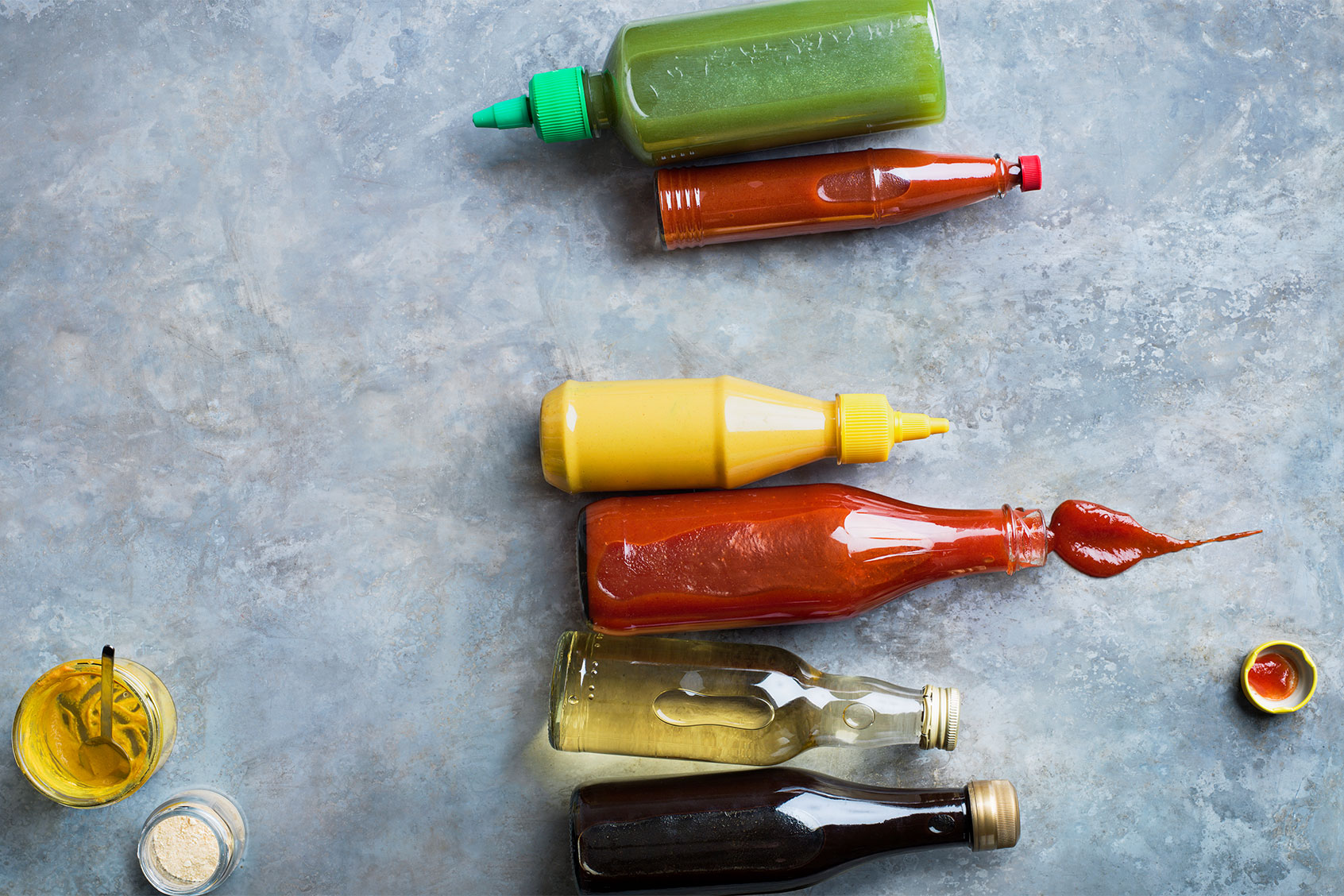 Condiments in bottles (Getty Images/Johner Images)