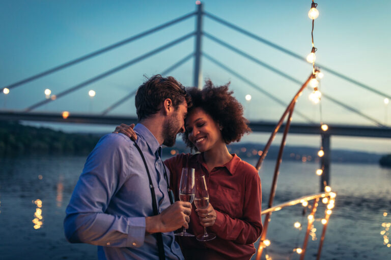 Attractive young couple hugging on a boat (Getty Images/bernardbodo)