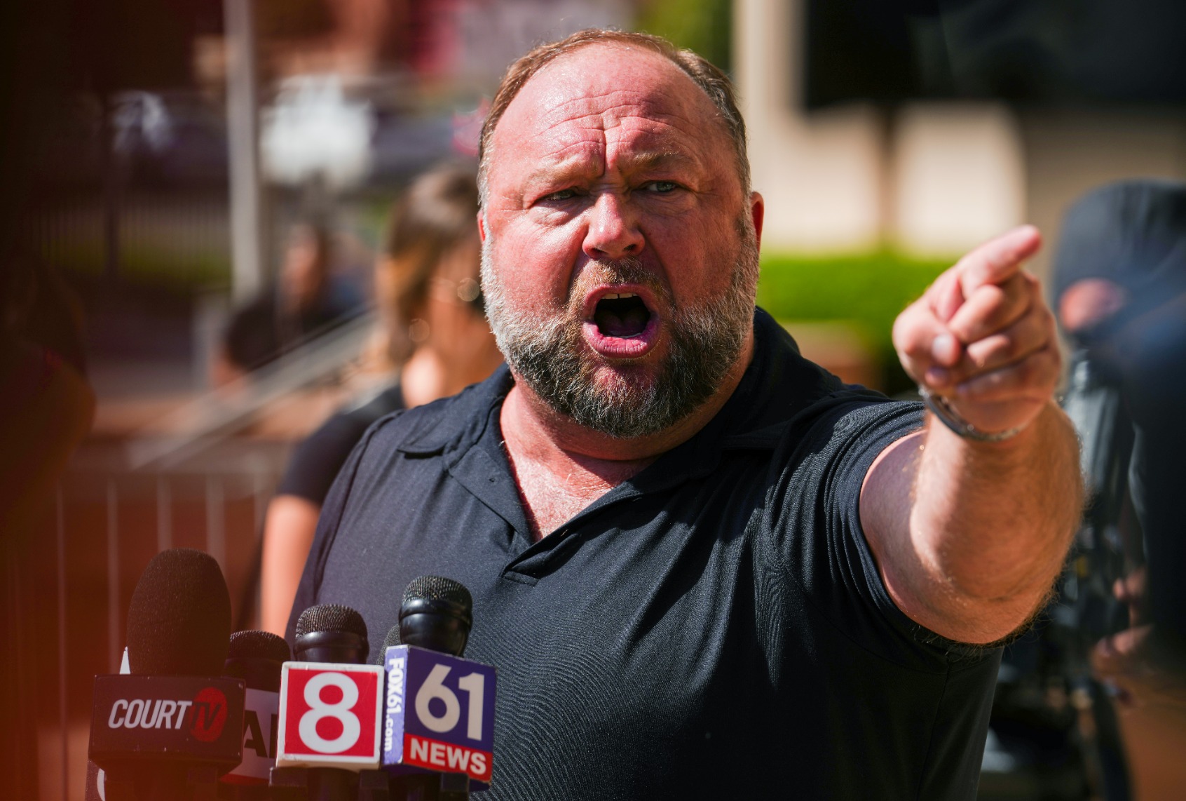 InfoWars founder Alex Jones speaks to the media outside Waterbury Superior Court during his trial on September 21, 2022 in Waterbury, Connecticut. (Joe Buglewicz/Getty Images)