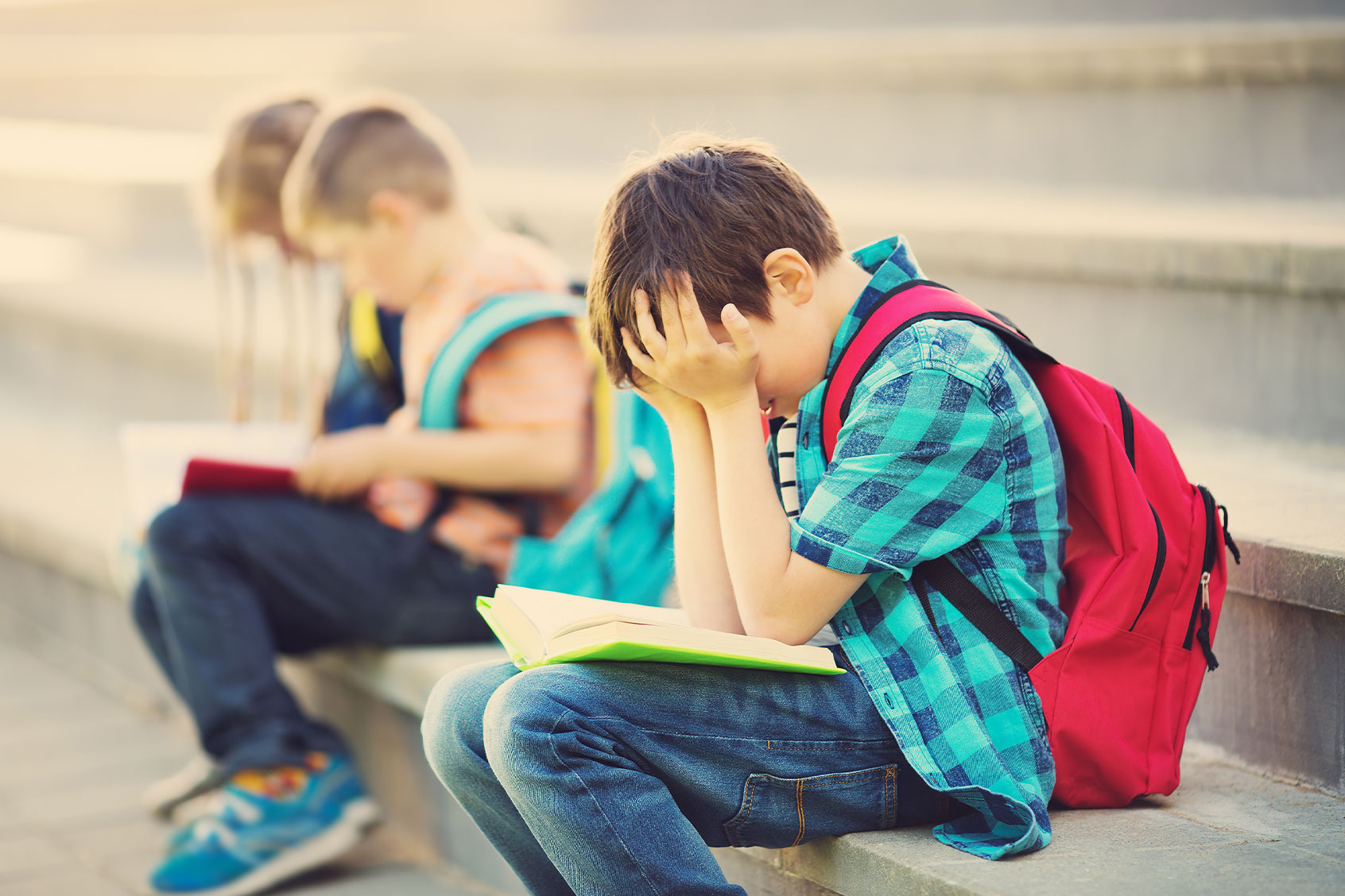 Child frustrated reading a book (Getty Images/LeManna)