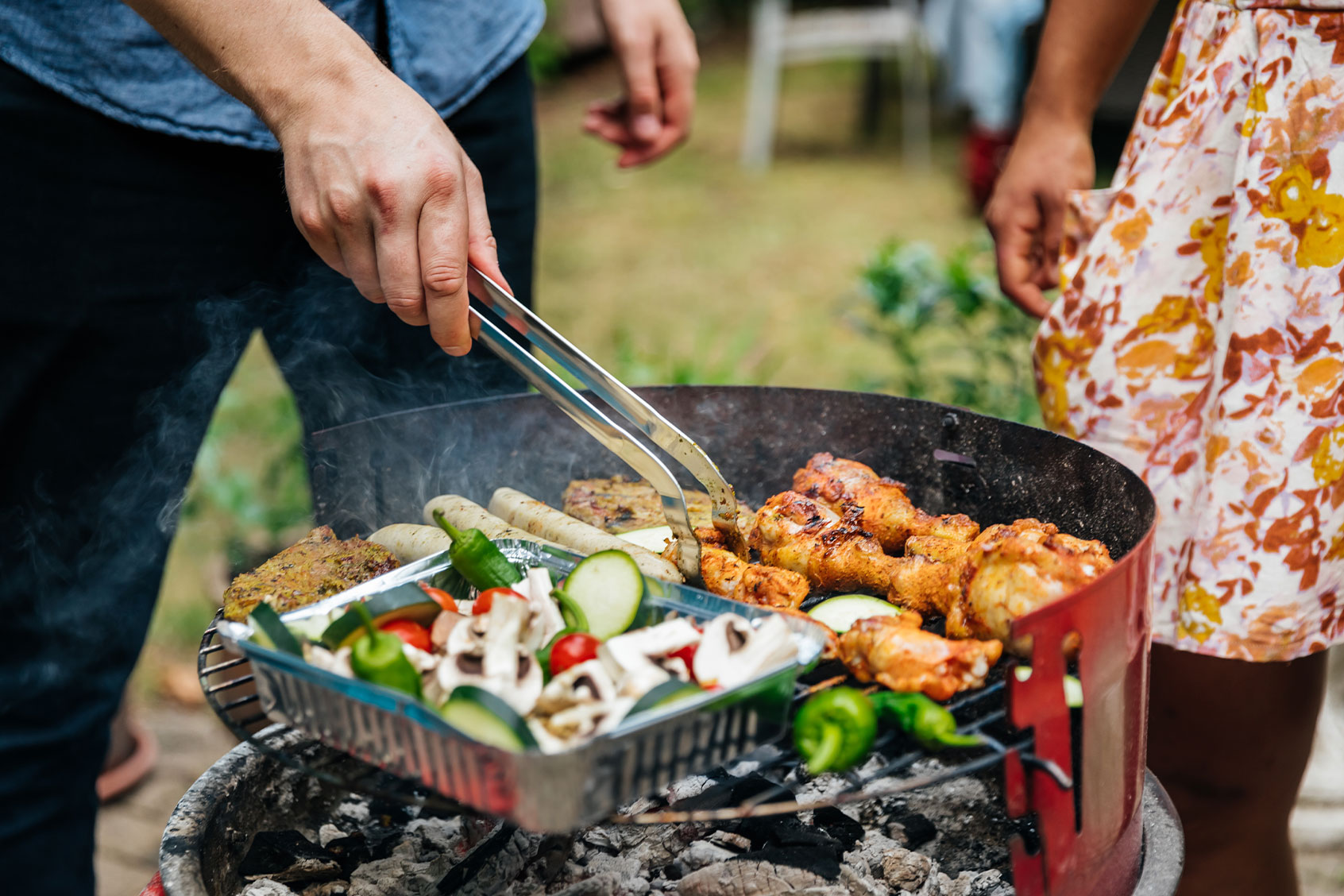 A man cooking food on BBQ (Getty Images/Hinterhaus Productions)