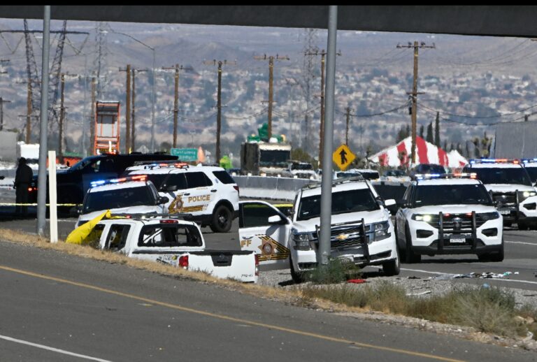 Law enforcement vehicles surrounded the vehicle driven by Anthony John Graziano, 45, following a gun battle with the man on the 15 freeway in Victorville Tuesday, Sept. 27, 2022. (Will Lester/MediaNews Group/Inland Valley Daily Bulletin via Getty Images)