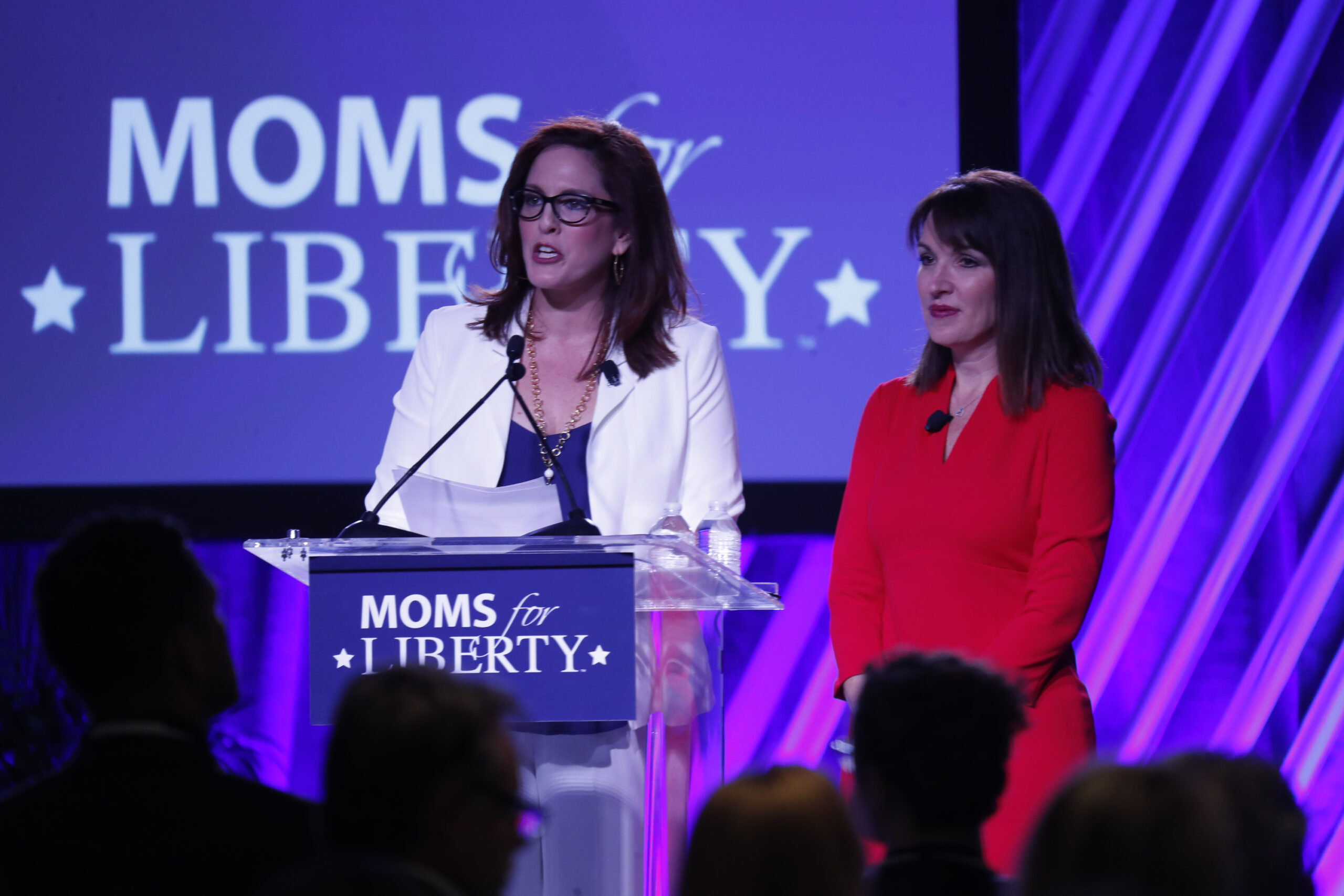 Moms for Liberty founders Tiffany Justice (left) and Tina Descovich give the opening remarks during the inaugural Moms For Liberty Summit on July 15, 2022, in Tampa, Florida. (Octavio Jones/Getty Images)