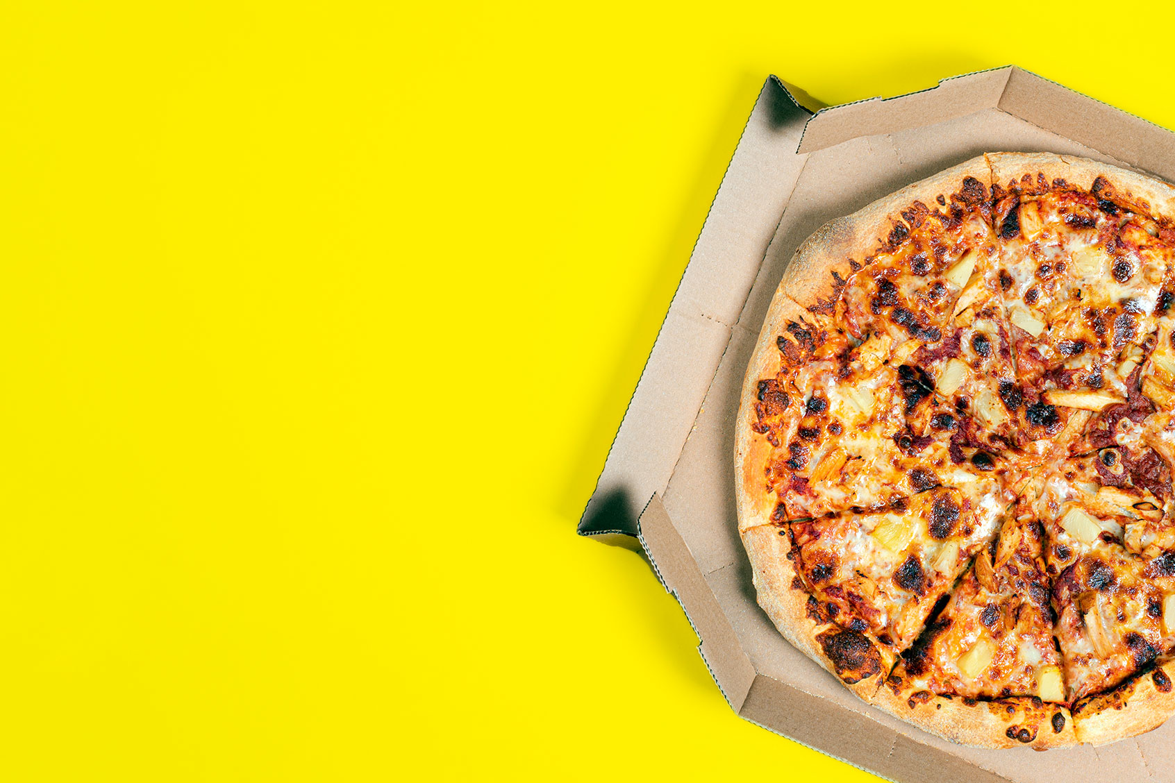 Hawaii pizza in a box (Getty Images/esvetleishaya)