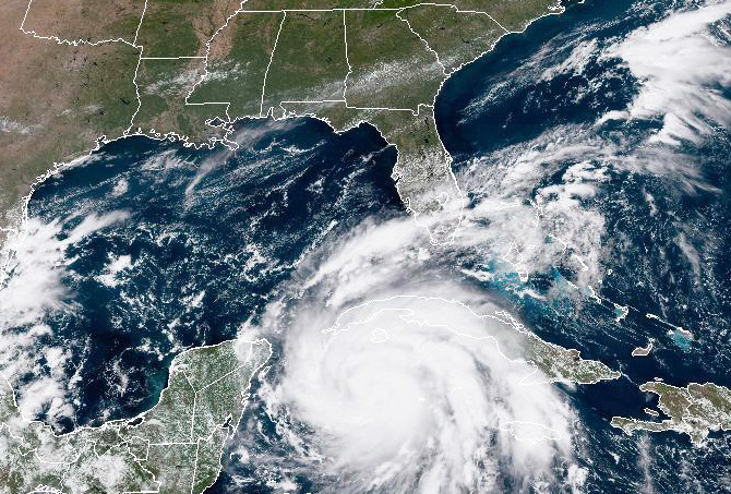 In this NOAA handout image taken by the GOES satellite at 16:56 UTC: shows Hurricane Ian as it moves toward western Cuba on September 26, 2022 in the Caribbean Sea. (Photo by NOAA via Getty Images)