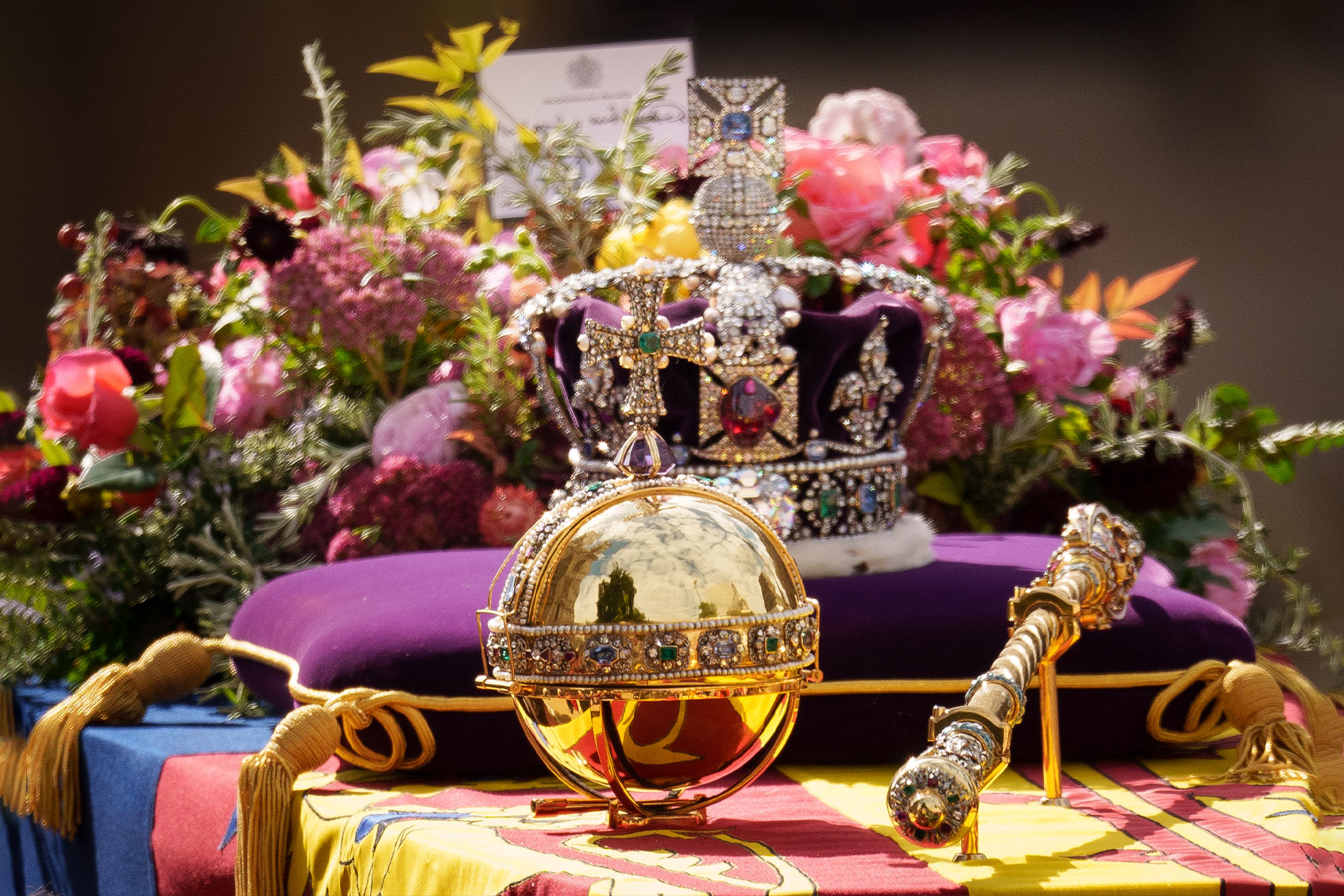 The coffin of Queen Elizabeth II with the Imperial State Crown resting on top is carried by the Bearer Party as it departs Westminster Abbey during the State Funeral of Queen Elizabeth II on September 19, 2022 in London, England. (Christopher Furlong/Getty Images)