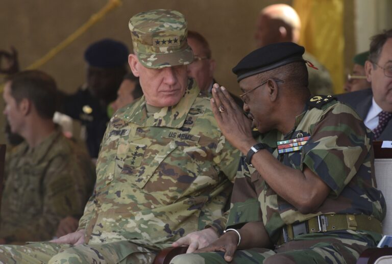 Senegalese Chief of Staff Mamadou Sow (R) speaks with former AFRICOM chief General David Rodriguez during three-week joint military exercise between African, US and European troops, known as Flintlock, on February 29, 2016 in Saint Louis. (SEYLLOU/AFP via Getty Images)