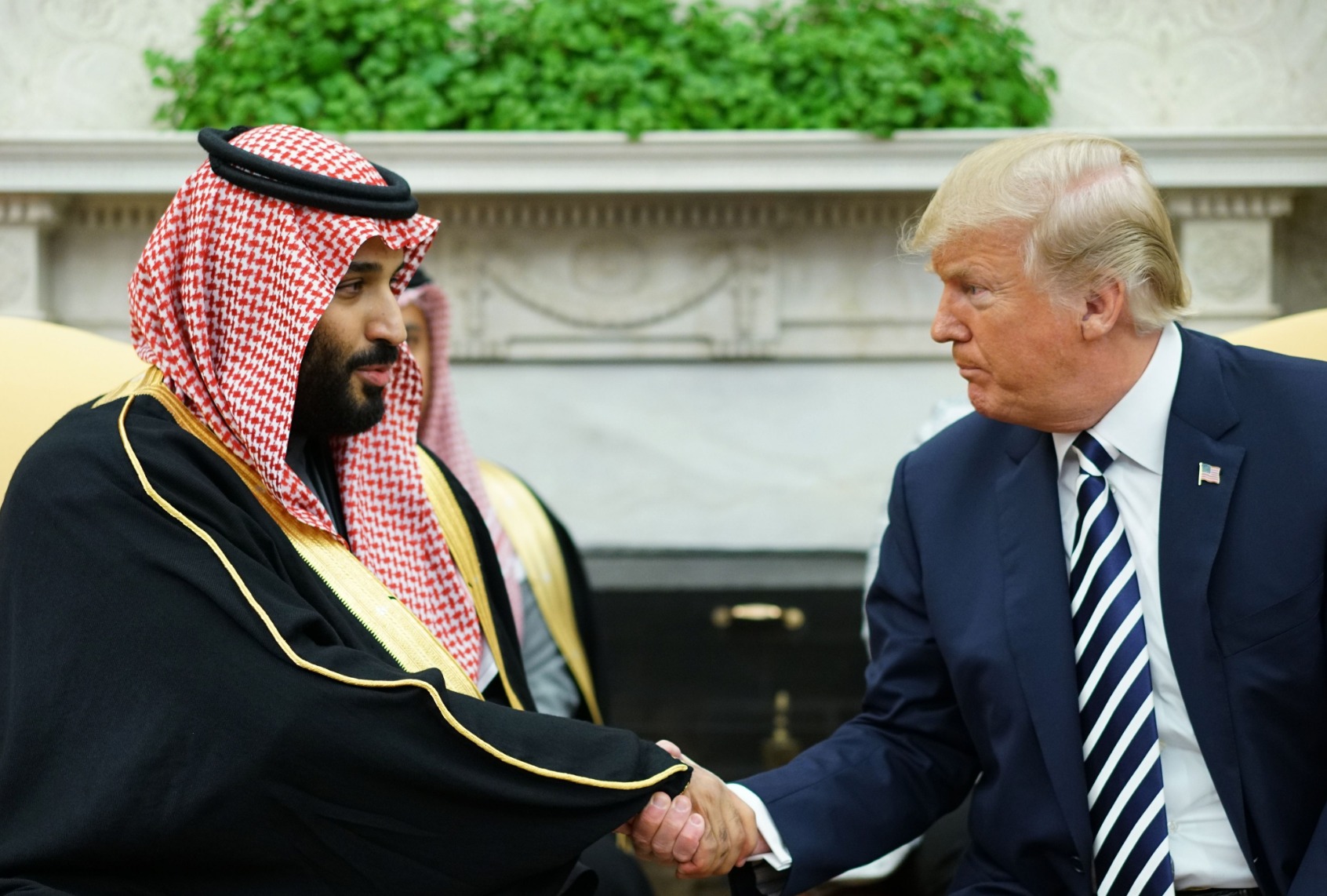 Former President Donald Trump shakes hands with Saudi Arabia's Crown Prince Mohammed bin Salman in the Oval Office of the White House on March 20, 2018 in Washington, DC. (MANDEL NGAN/AFP via Getty Images)