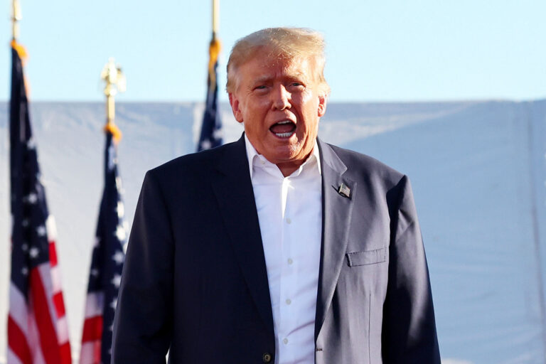 Former U.S. President Donald Trump walks to the podium for a campaign rally at Legacy Sports USA on October 09, 2022 in Mesa, Arizona. (Mario Tama/Getty Images)