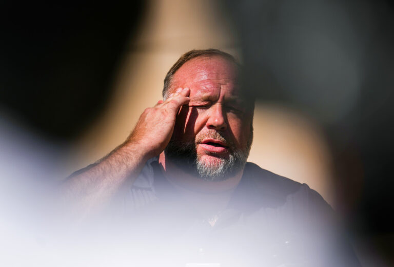 Alex Jones speaks to the media outside the Sandy Hook Trial in Waterbury, Connecticut (Joe Buglewicz/Getty Images)