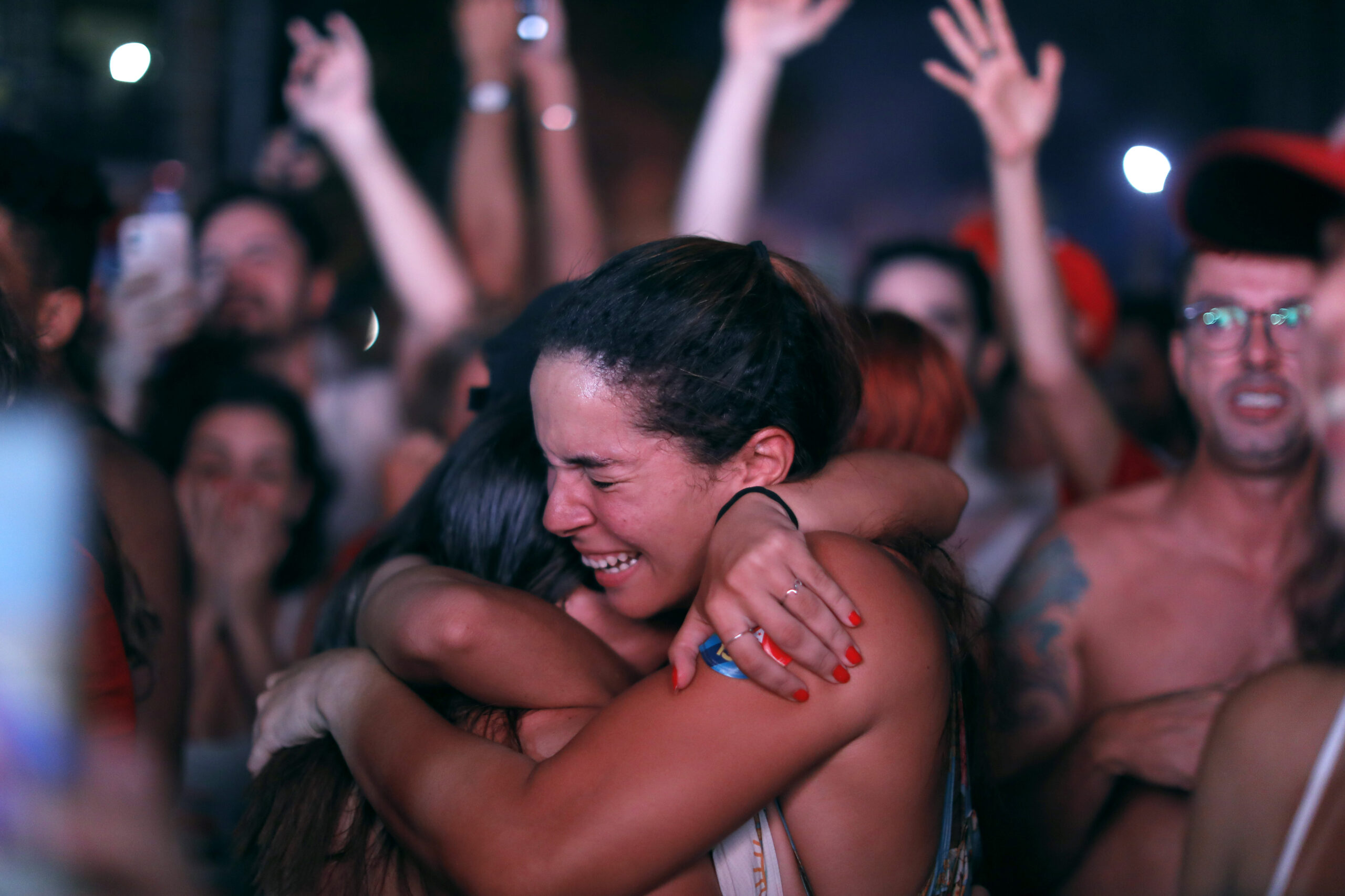 Supporters of Luiz Inácio Lula da Silva break into tears as official vote count shows him as the winner of Brazil's presidential runoff election on Oct. 30, 2022, in Rio de Janeiro. (Joao Laet/Getty Images)