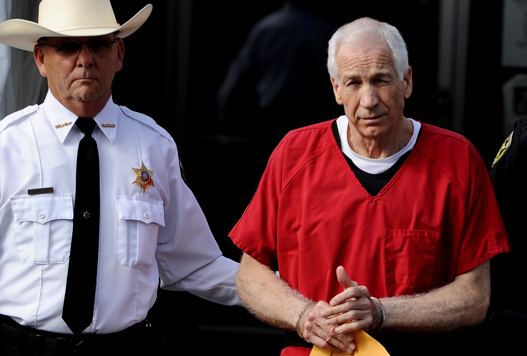 Former Penn State assistant football coach Jerry Sandusky leaves the Centre County Courthouse after being sentenced in his child sex abuse case on October 9, 2012 in Bellefonte, Pennsylvania. (Patrick Smith/Getty Images)