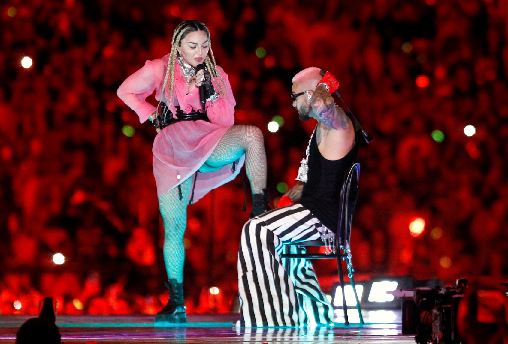 Colombian singer Maluma (R) performs on stage along with pop icon Madonna during his concert "Medallo in the Map", in Medellin, Colombia, on April 30, 2022. (FREDY BUILES/AFP via Getty Images)