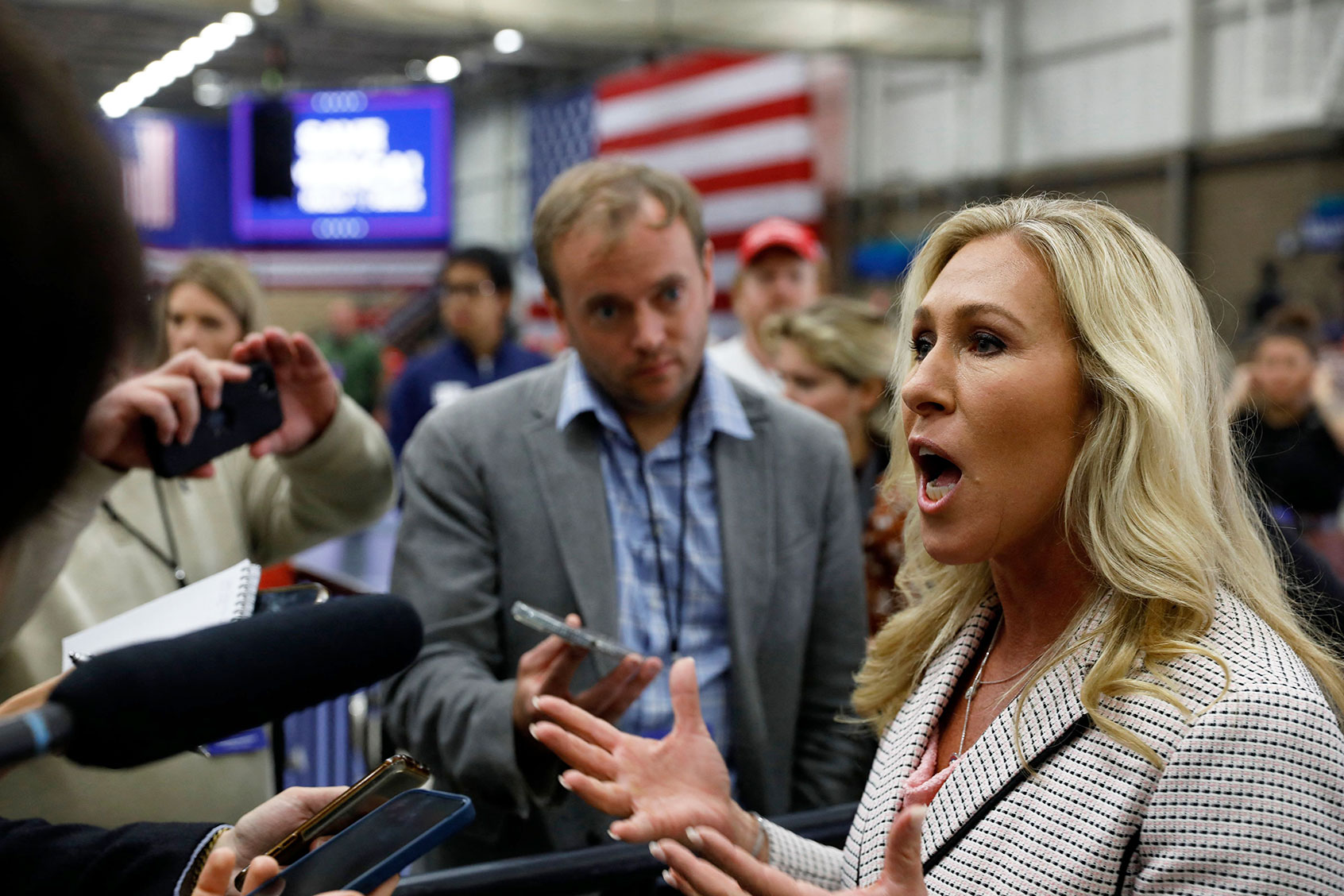 US Republican Representative Marjorie Taylor Greene of Georgia talks to reporters before former US president Donald Trump speaks at a "Save America" rally in Warren, Michigan, on October 1, 2022. (JEFF KOWALSKY/AFP via Getty Images)