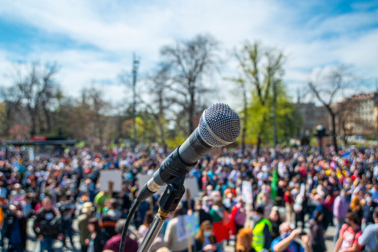 A microphone on the stage with crowd in background (Getty Images/Krle)