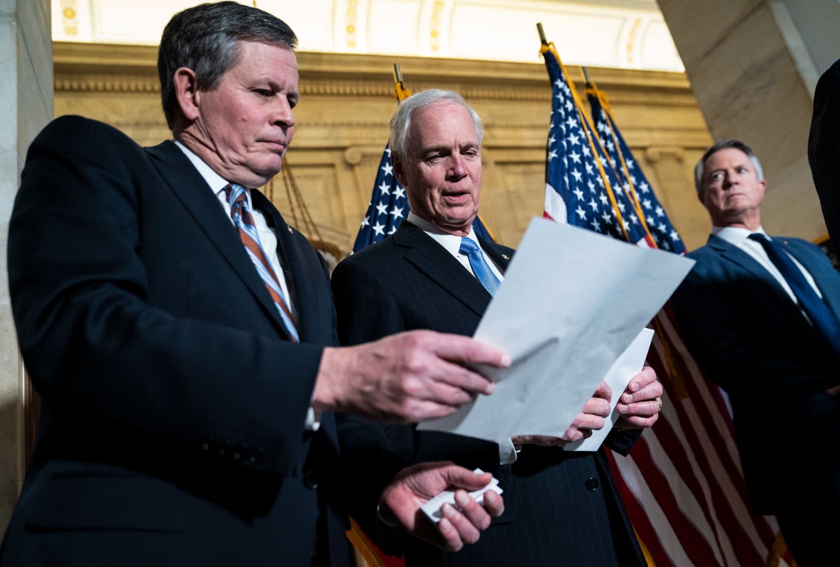 Sen. Steve Daines, R-Mont., and Sen. Ron Johnson, R-Wis., listen during a press conference about crime on Capitol Hill on Wednesday, Feb. 09, 2022 in Washington, DC. (Jabin Botsford/The Washington Post via Getty Images)