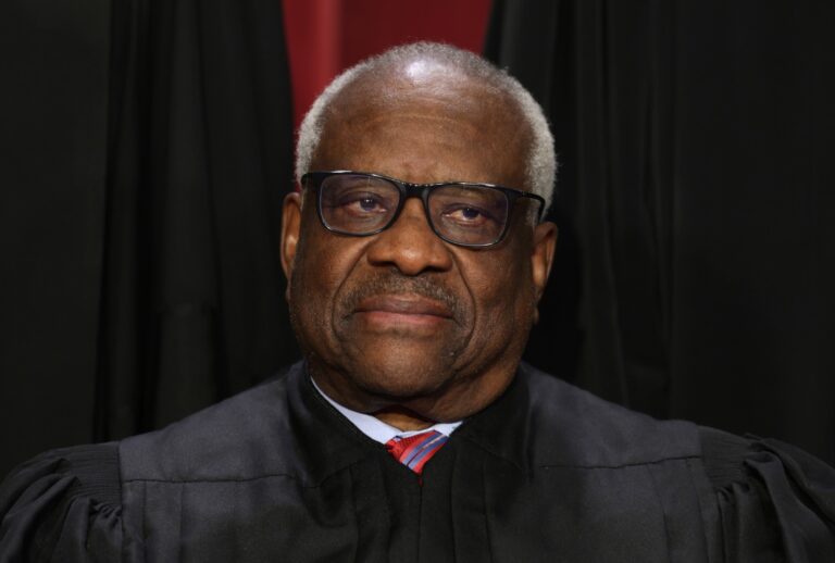 United States Supreme Court Associate Justice Clarence Thomas poses for an official portrait at the East Conference Room of the Supreme Court building on October 7, 2022 in Washington, DC. (Alex Wong/Getty Images)
