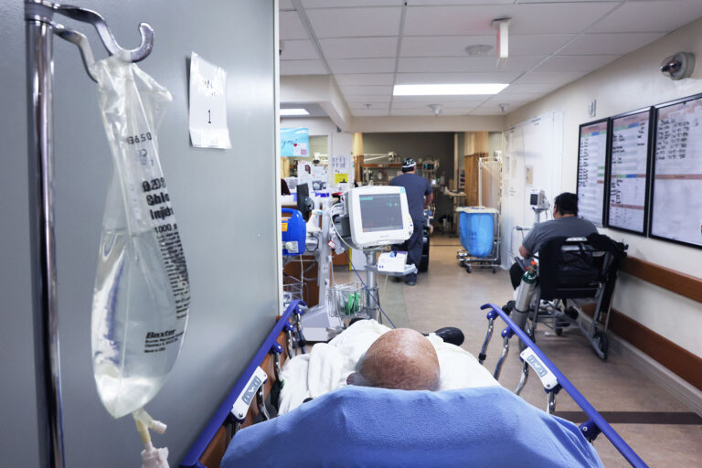 Patients rest in a hallway in the overloaded Emergency Room area at Providence St. Mary Medical Center on January 27, 2021 in Apple Valley, California. (Mario Tama/Getty Images)