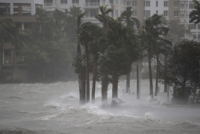 Water flows out of the Miami River to flood a walkway as Hurricane Irma passes through on September 10, 2017 in Miami, Florida. (Joe Raedle/Getty Images)