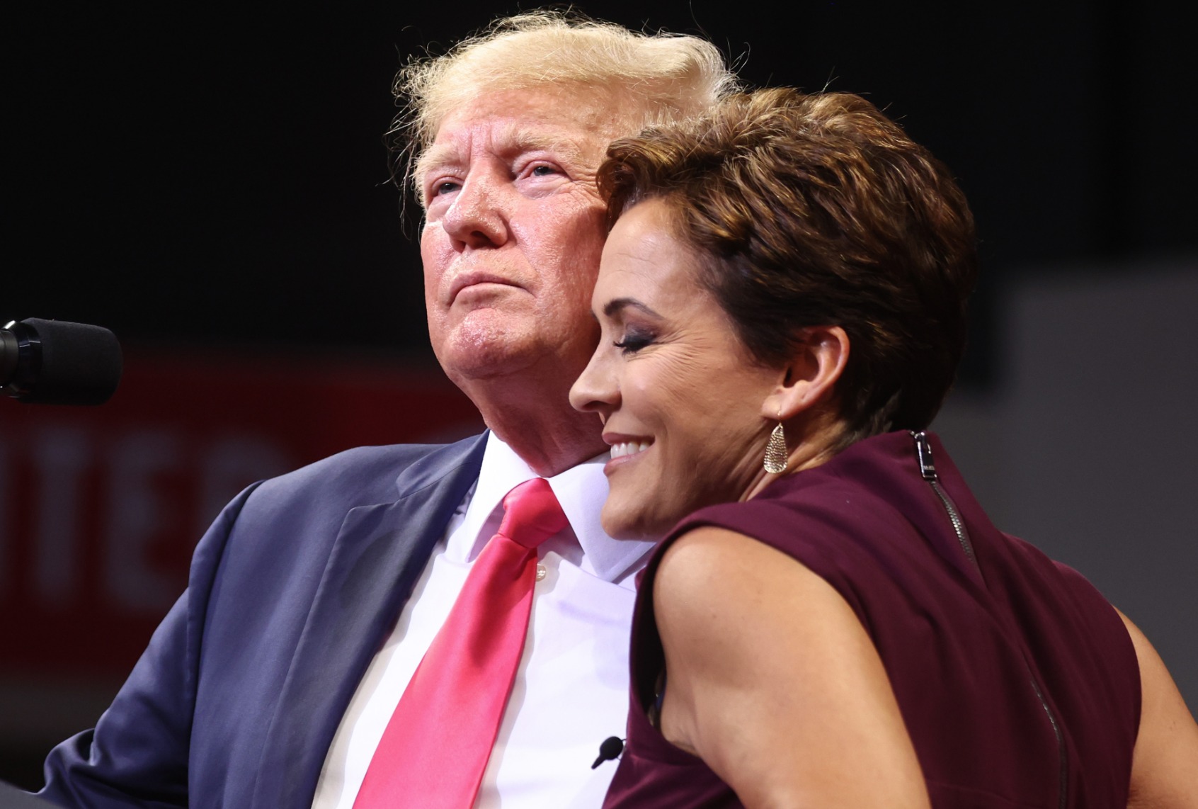 Former President Donald Trump embraces Republican candidate for governor Kari Lake at a "Save America" rally on July 22, 2022 in Prescott Valley, Arizona. (Mario Tama/Getty Images)