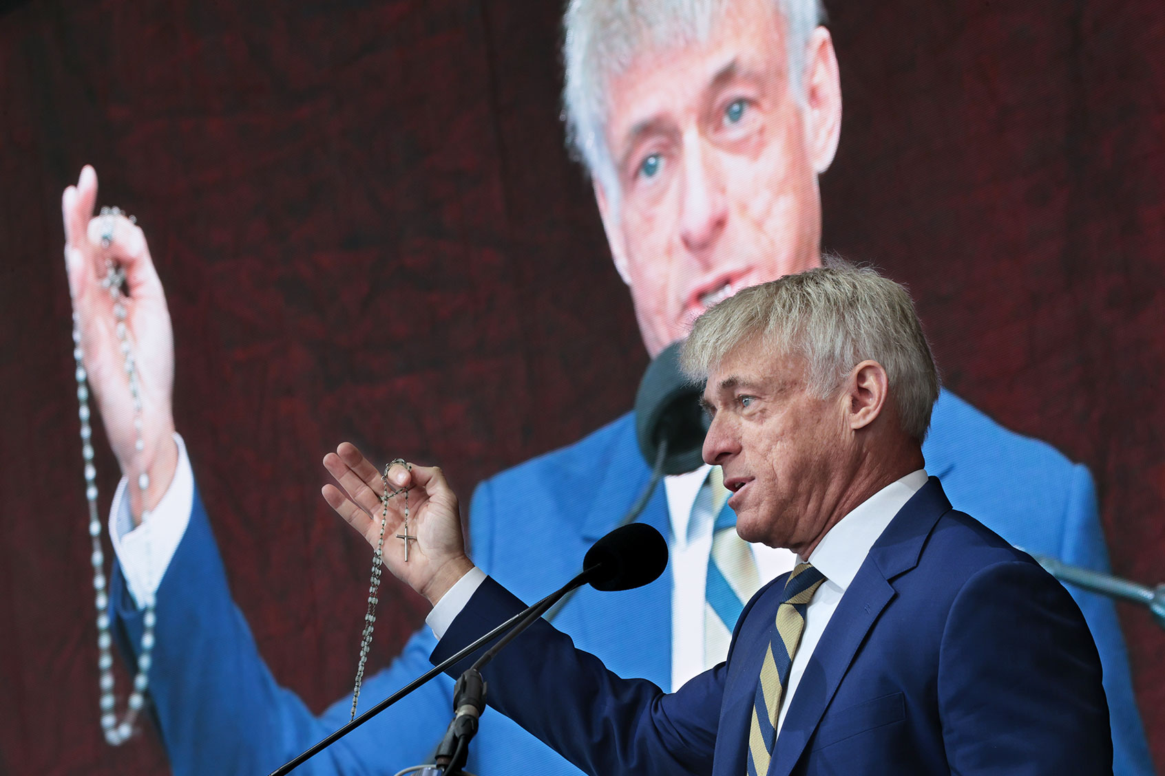 St. Michael's Media founder and CEO Michael Voris holds up a rosary while addressing the ‘Bishops Enough Is Enough’ rally at the MECU Pavilion November 16, 2021 in Baltimore, Maryland. (Chip Somodevilla/Getty Images)
