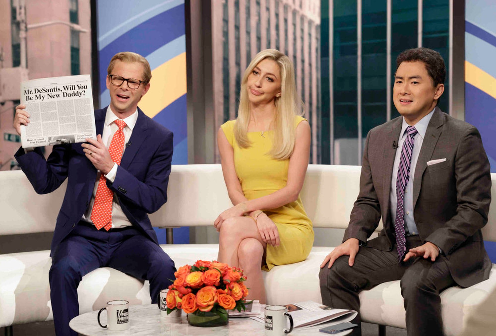 Mikey Day as Steve Doocy, Heidi Gardner as Ainsley Earhardt, and Bowen Yang as Brian Kilmeade during “Fox & Friends” Cold Open on Saturday, November 12, 2022 (Will Heath/NBC)