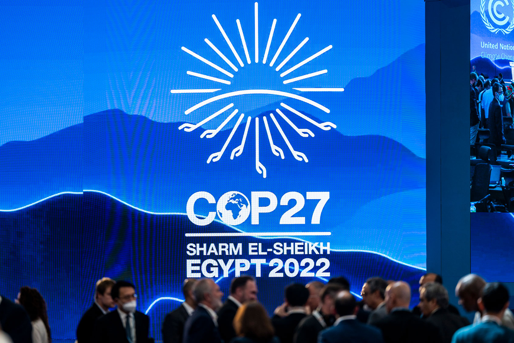 Participants talk to each other during a break in the closing ceremony at the UN Climate Summit COP27. (Christophe Gateau/picture alliance via Getty Images)