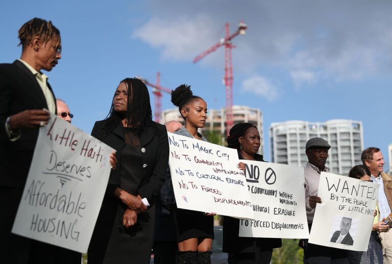 Residents and activists protest, in front of the Miami City Hall, against the proposed office, retail and residential project planned for Little Haiti on March 28, 2019 in Miami, Florida. (Joe Raedle/Getty Images)