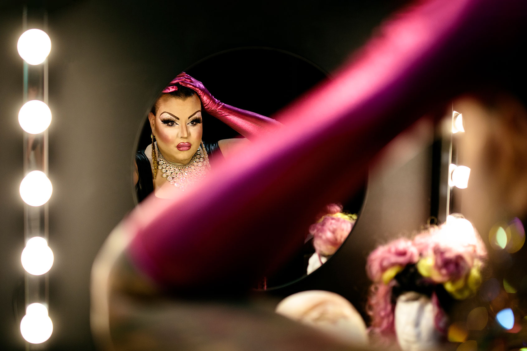 Drag queen admiring herself in the mirror in a dressing room (Getty Images/Jesus Calonge)