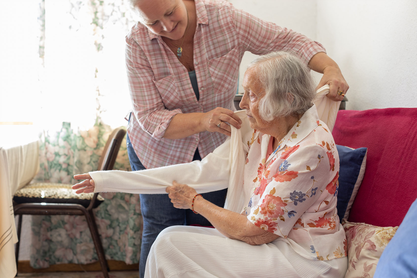 Mature woman caring for her elderly mother (Getty Images/Alistair Berg)