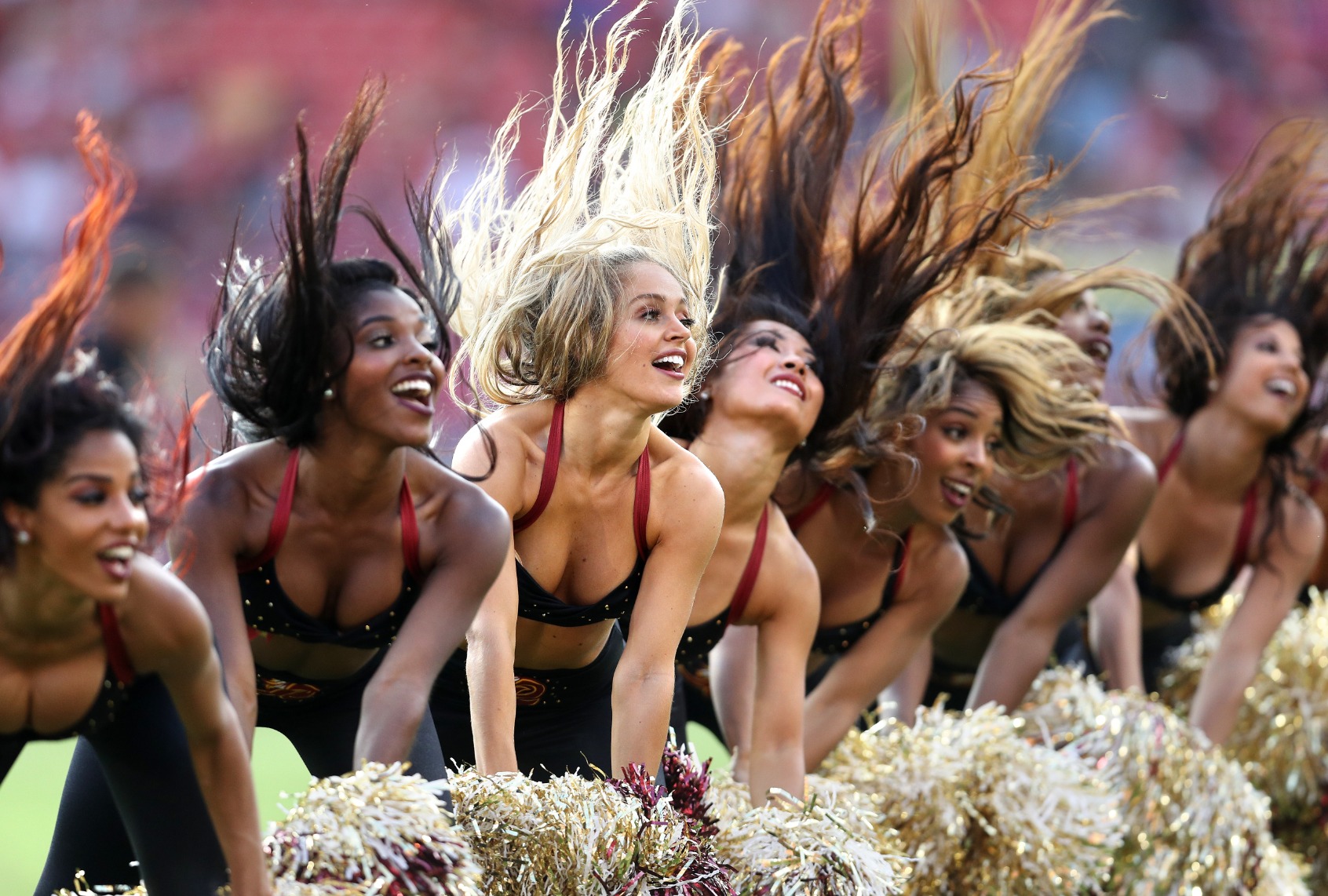 Washington cheerleaders dance during a stoppage in play during a preseason game at FedExField on August 27, 2017 in Landover, Maryland. (Patrick Smith/Getty Images)