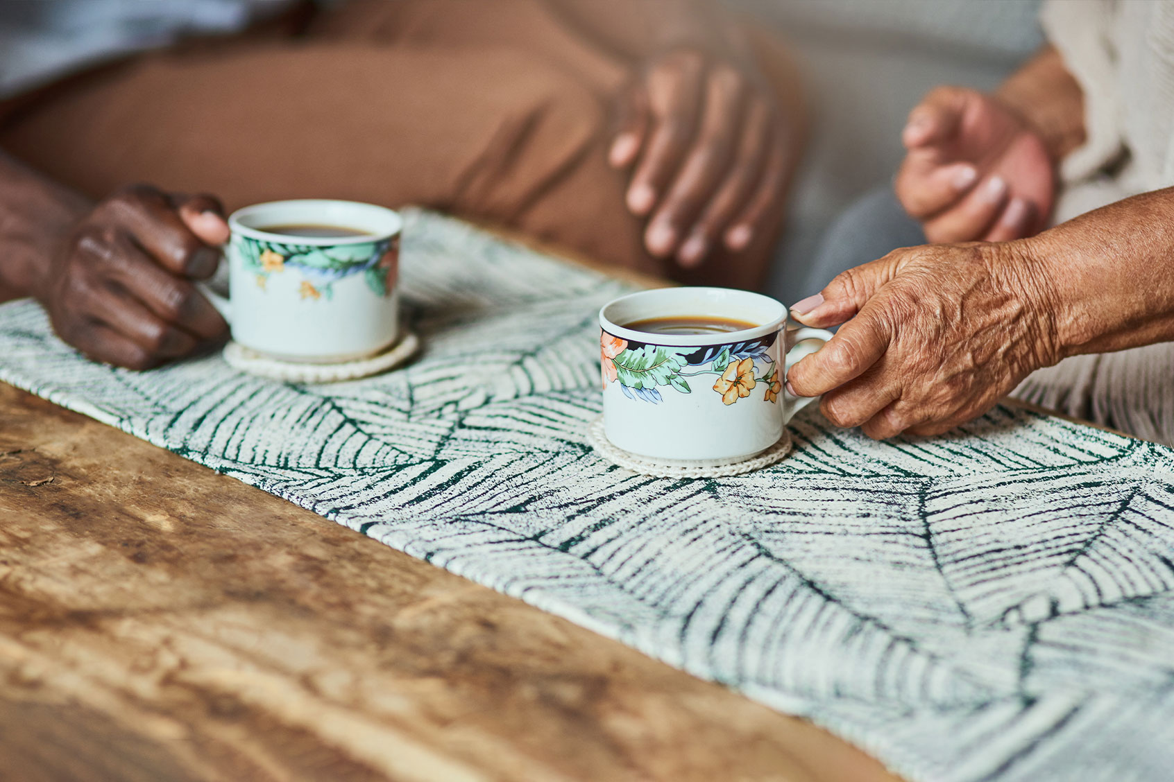 Two people having coffee together (Getty Images/Adene Sanchez)