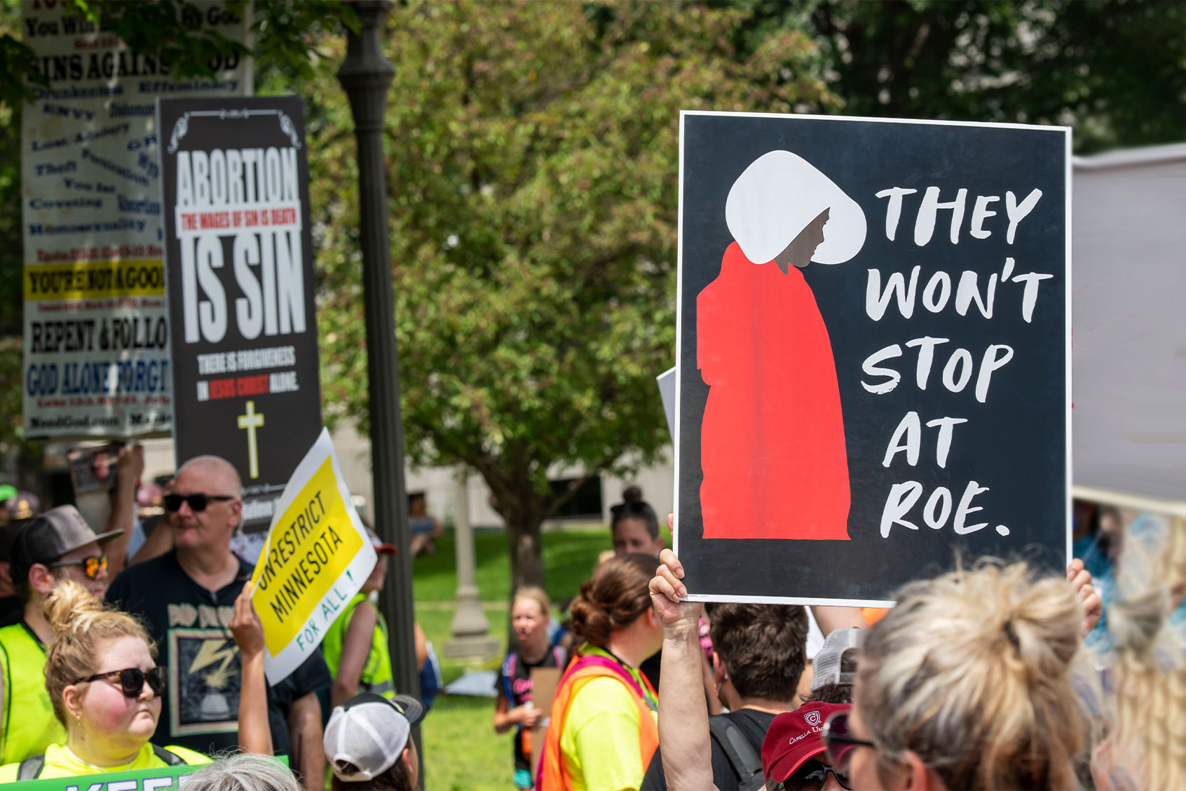 Thousands march and rally in support of legal abortion access after the U.S. Supreme court overturned the federal constitutional right to an abortion. Anti and pro demonstraters hold up signs showing their different opinions. Anti demonstrators yelling that Jesus would not forgive them. (Michael Siluk/UCG/Universal Images Group via Getty Images)