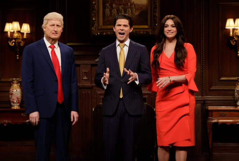 James Austin Johnson as Donald Trump, Mikey Day as Donald Trump Jr., and Cecily Strong as Kimberly Guilfoyle during the “Trump NFT” Cold Open on Saturday Night Live, December 17, 2022 (Will Heath/NBC)