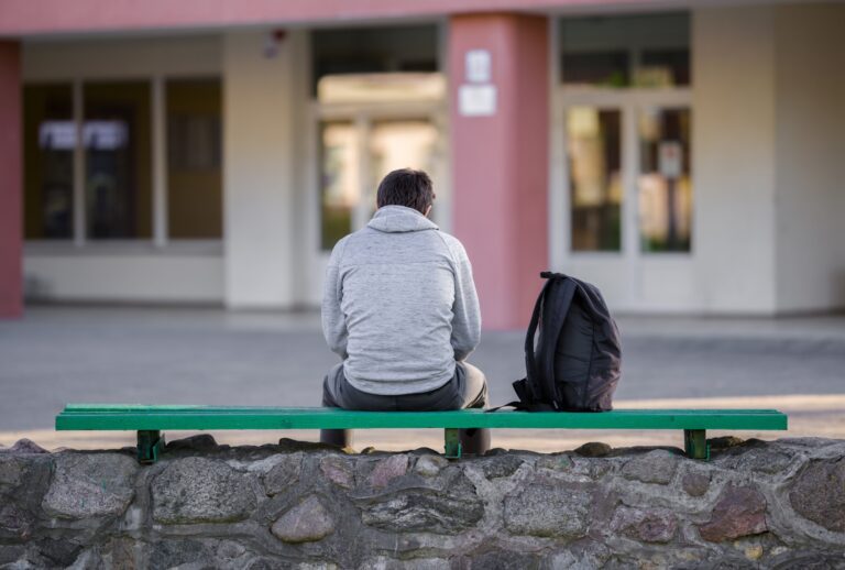 Student in school yard. (FotoDuets/Getty Images)