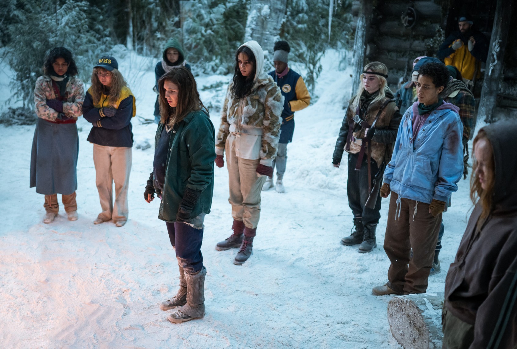 (L-R): Nuha Jes Izman as Teen Crystal, Samantha Hanratty as Teen Misty, Alexa Barajas as Teen Mari, Sophie Nélisse as Teen Shauna, Courtney Eaton as Teen Lottie, Nia Sondaya as Teen Akilah, Sophie Thatcher as Teen Natalie, Jasmin Savoy Brown as Teen Taissa, Steven Krueger as Ben Scott and Liv Hewson as Teen Van in "Yellowjackets" Season 2. (Kailey Schwerman/SHOWTIME)
