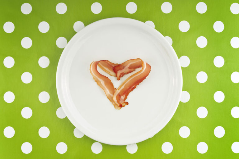 Bacon strips in the shape of a heart (Getty Images/stevanovicigor)