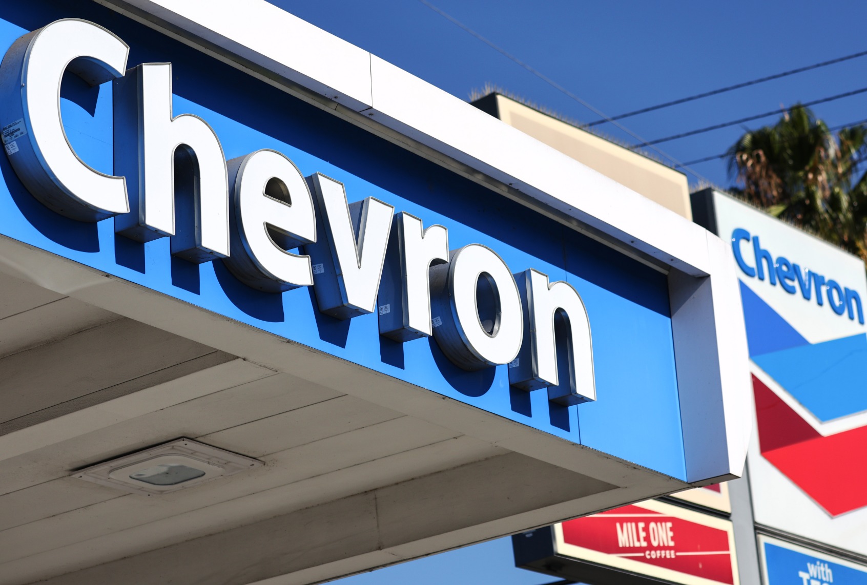 The Chevron logo is displayed at a Chevron gas station on October 28, 2022 in Los Angeles, California. Chevron posted near record profits as their quarterly profit rose 84 percent to $11.23 billion amid a surge in oil prices during the quarter. ( Mario Tama/Getty Images)