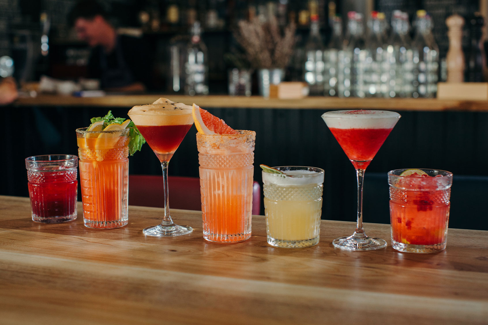 Cocktails on a bar counter (Getty Images/honey_and_milk)