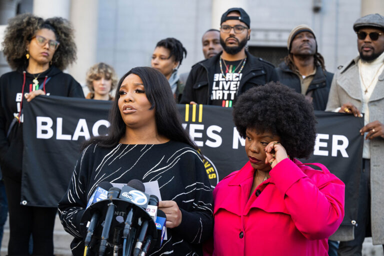 Dominique Anderson, sister of Keenan Anderson, who died after he was tased and restrained by LAPD, and his cousin and Black Lives Matter co-founder Patrisse Cullors hold a press conference demanding LAPD reforms at LA City Hall on Tuesday, January 17, 2023. (Sarah Reingewirtz/MediaNews Group/Los Angeles Daily News via Getty Images)
