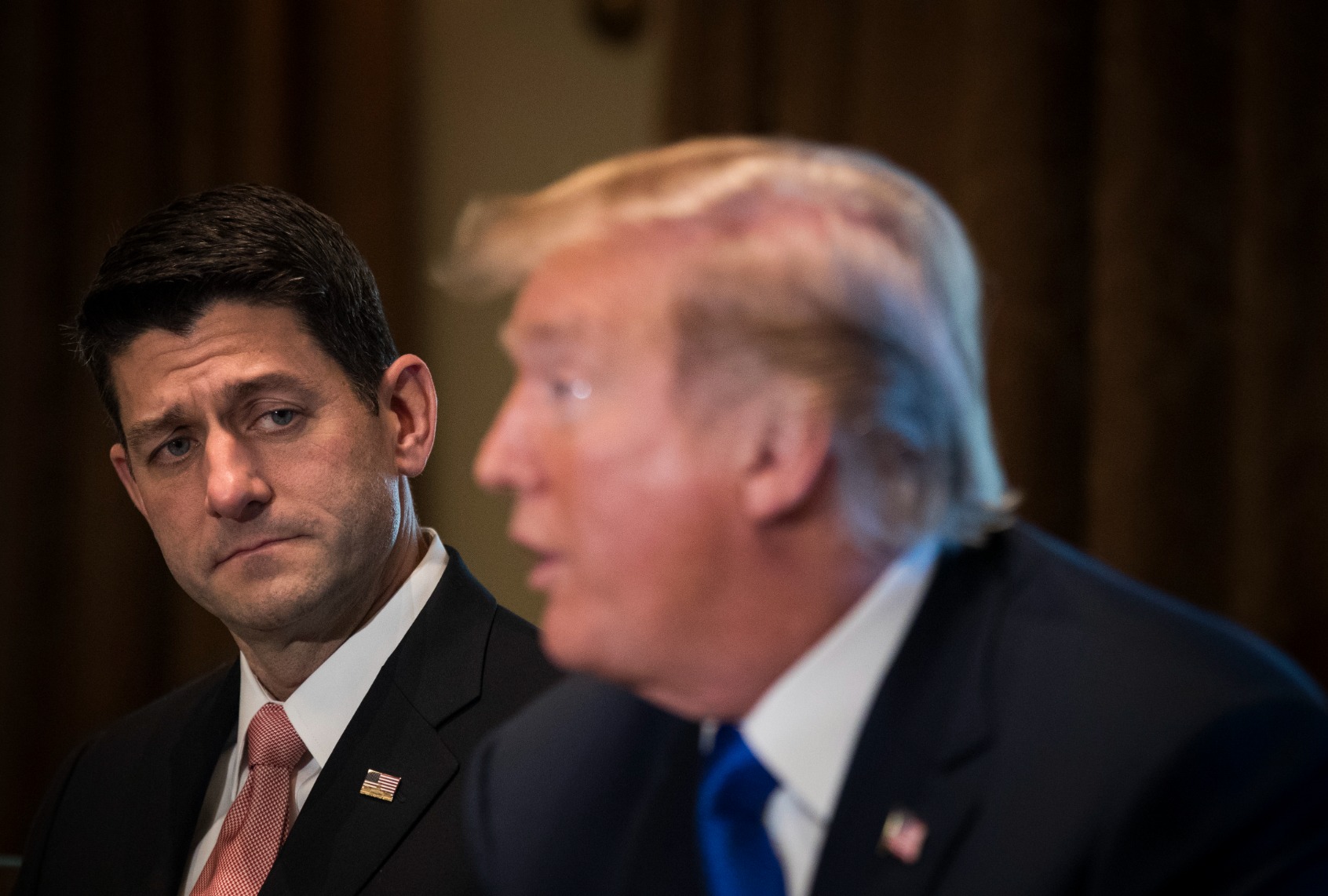 Former House Speaker Paul Ryan looks on as former President Donald Trump speaks about tax reform legislation during a meeting with members of the House Ways and Means Committee in the Cabinet Room at the White House, November 2, 2017 in Washington, DC. (Drew Angerer/Getty Images)