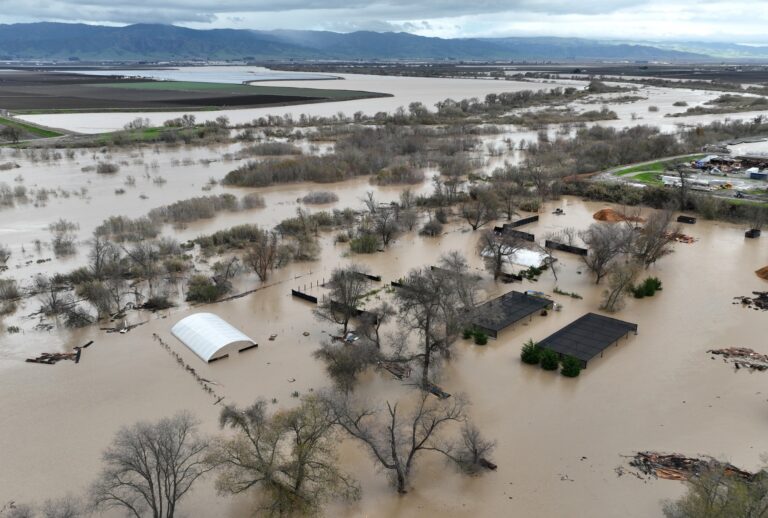 In an aerial view, floodwaters cover an agricultural area after the Salinas River overflowed its banks on January 13, 2023 in Salinas, California. (Justin Sullivan/Getty Images)