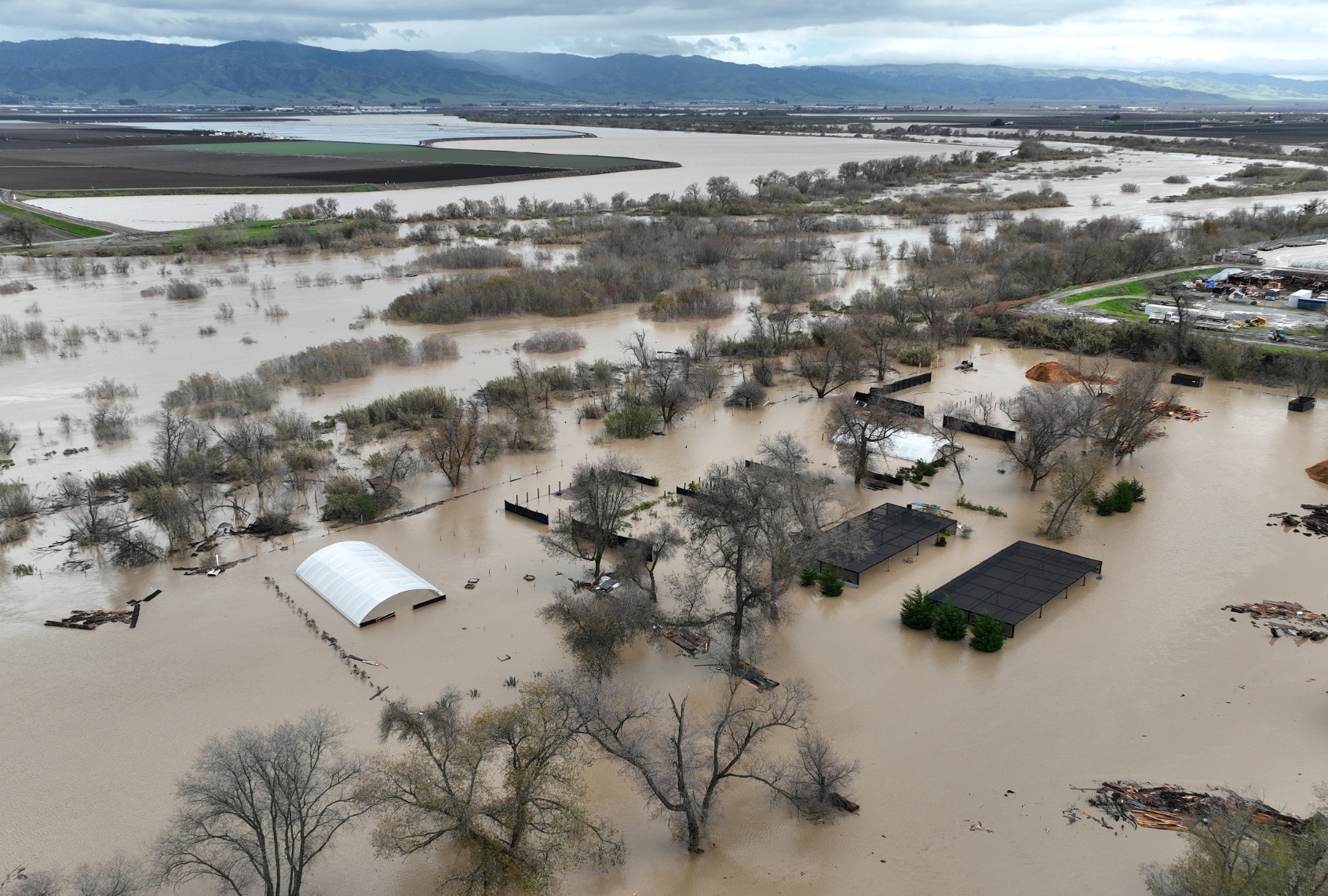 In an aerial view, floodwaters cover an agricultural area after the Salinas River overflowed its banks on January 13, 2023 in Salinas, California. (Justin Sullivan/Getty Images)