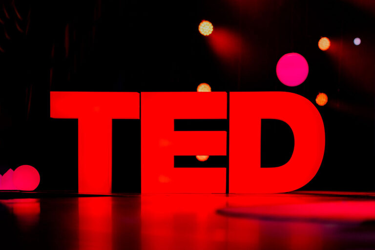 The TED logo stands illuminated on stage in the Community Theater in Vancouver, Canada. (Lawrence Sumulong/Getty Images)