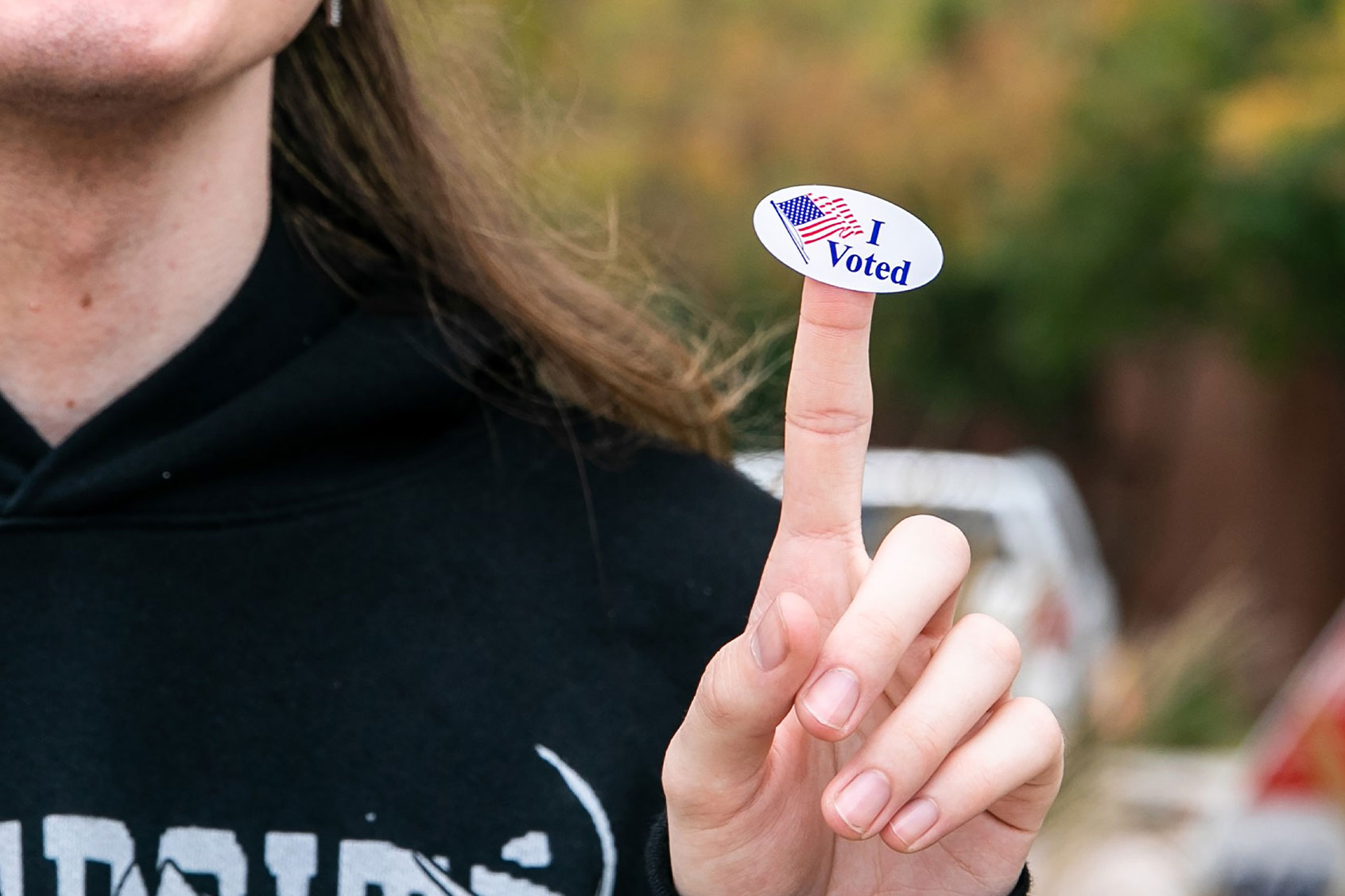 A young man who just voted shows his voting sticker in Plano, Texas, the United States, on Nov. 8, 2022. (Xin Jin/Xinhua via Getty Images)
