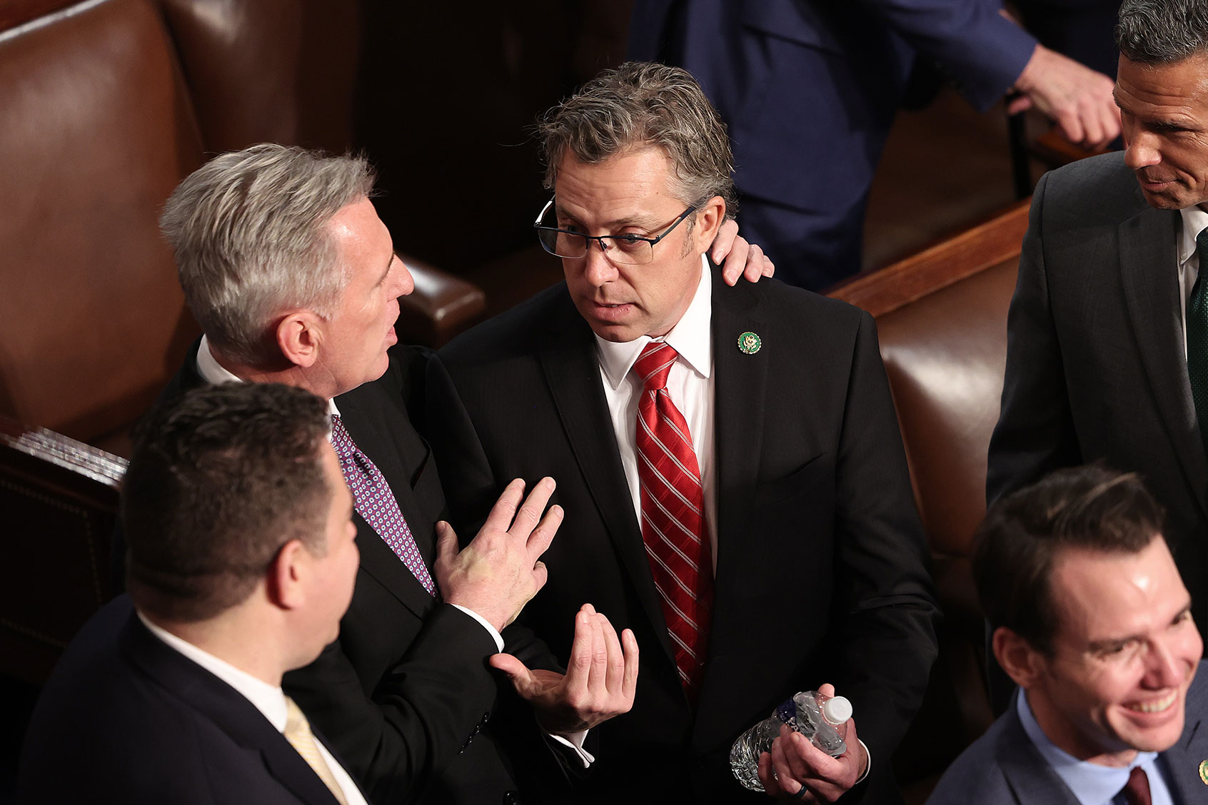 House Republican leader Kevin McCarthy (R-CA) (L) talks with Rep.-elect Andy Ogles (R-TN) in the House Chamber following a day of votes for the new Speaker of the House at the U.S. Capitol on January 04, 2023 in Washington, DC. (Kevin Dietsch/Getty Images)