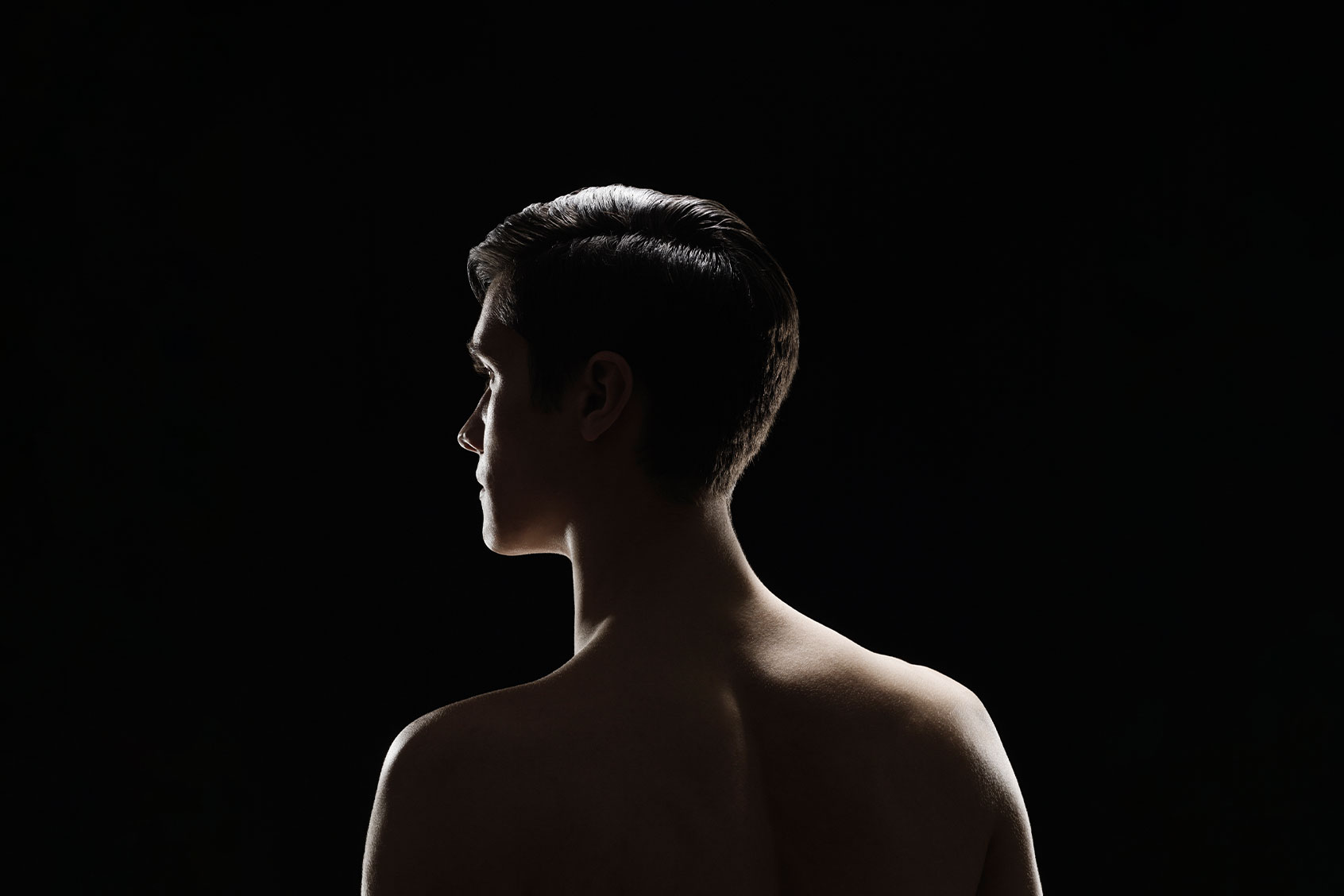 Back view of shirtless man (Getty Images/Jonathan Knowles)